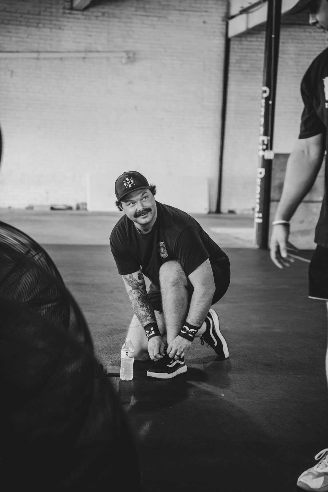 Firefighter tying his shoes before the workout at CrossFit Prevail