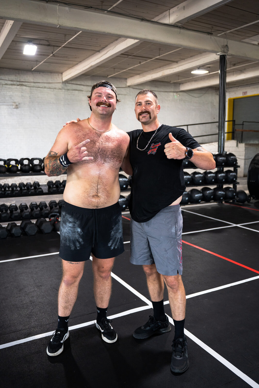 Two men posing together after a workout at CrossFit Prevail